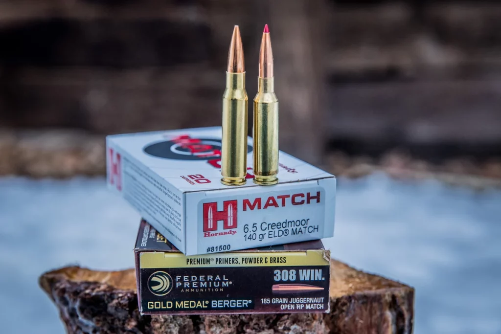 Side by side comparison of 6.5 Creedmoor and .308 Winchester ammunition commonly used in hunting sniper best guns.