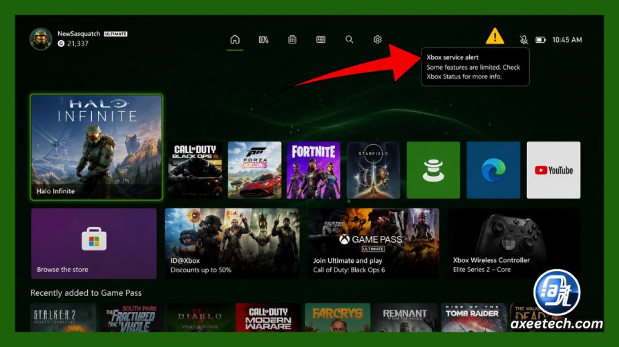 Xbox dashboard showing service status alert icon in upper right corner